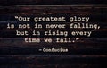 Our greatest glory is not in never falling, but in rising every time we fall. Inspirational quote on vintage retro background. Royalty Free Stock Photo